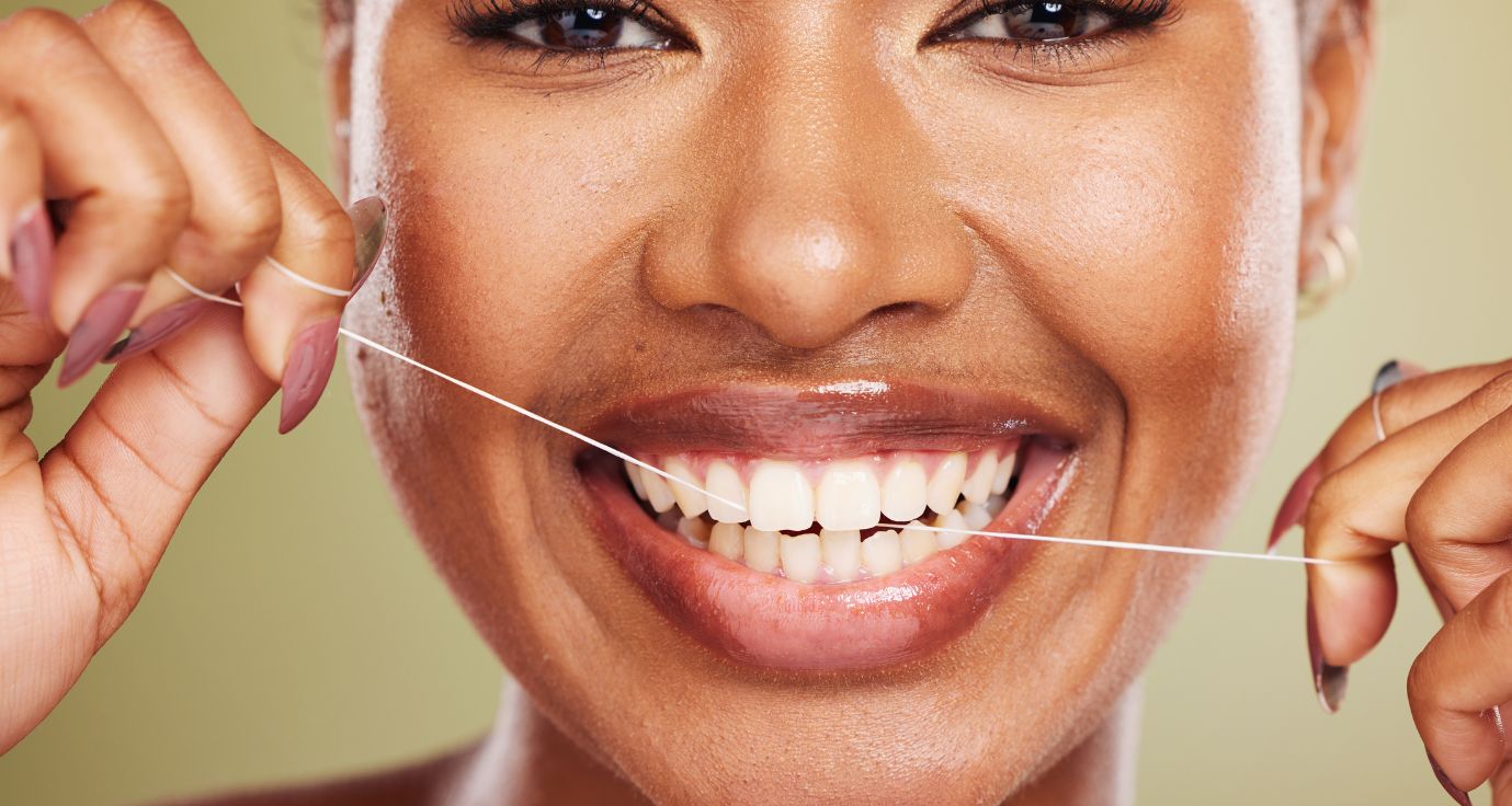 Woman smiling widely after gummy smile treatment