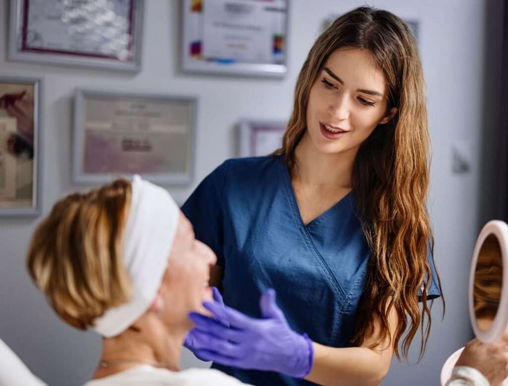 A medical practitioner examining a patients face during a consultation